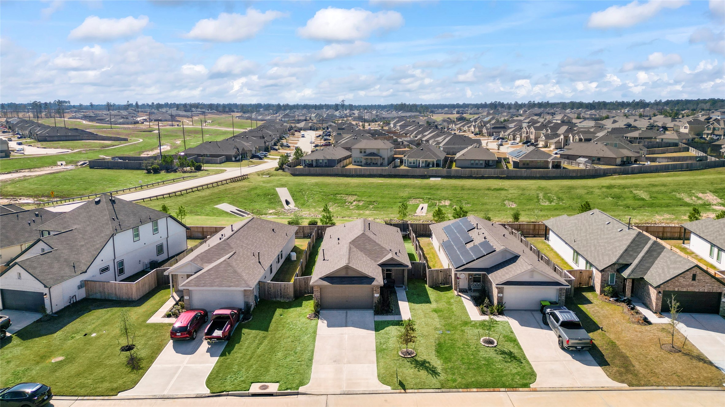 126 Spring Rose Drive Magnolia, TX 77354 - Photo 6 of 48 an aerial view of a house with a ocean view
