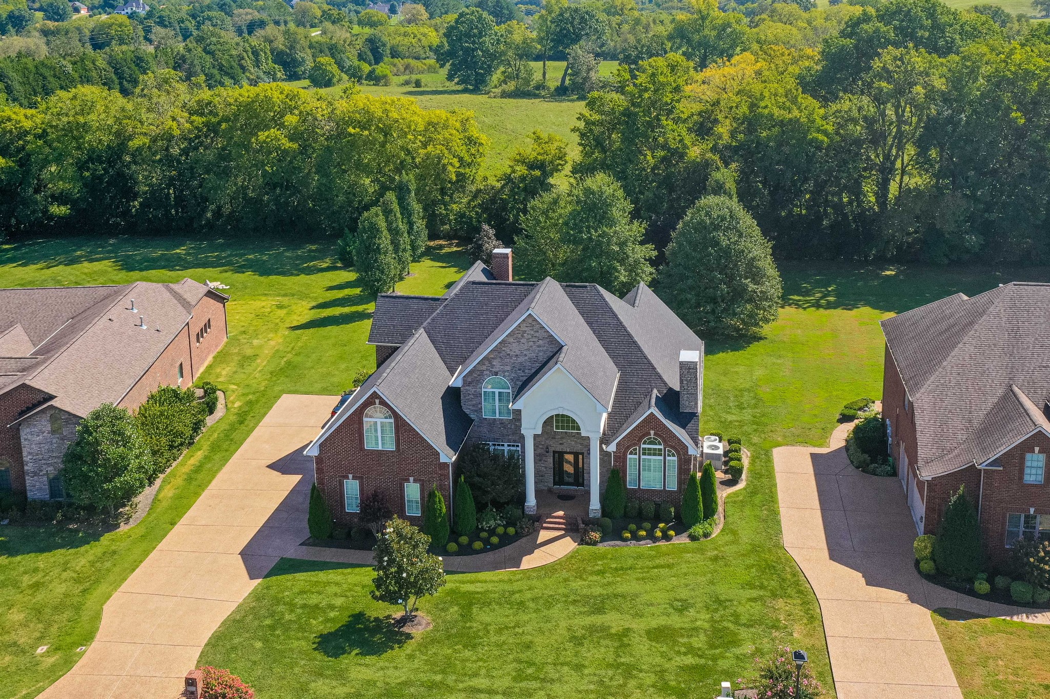 a aerial view of a house in a big yard