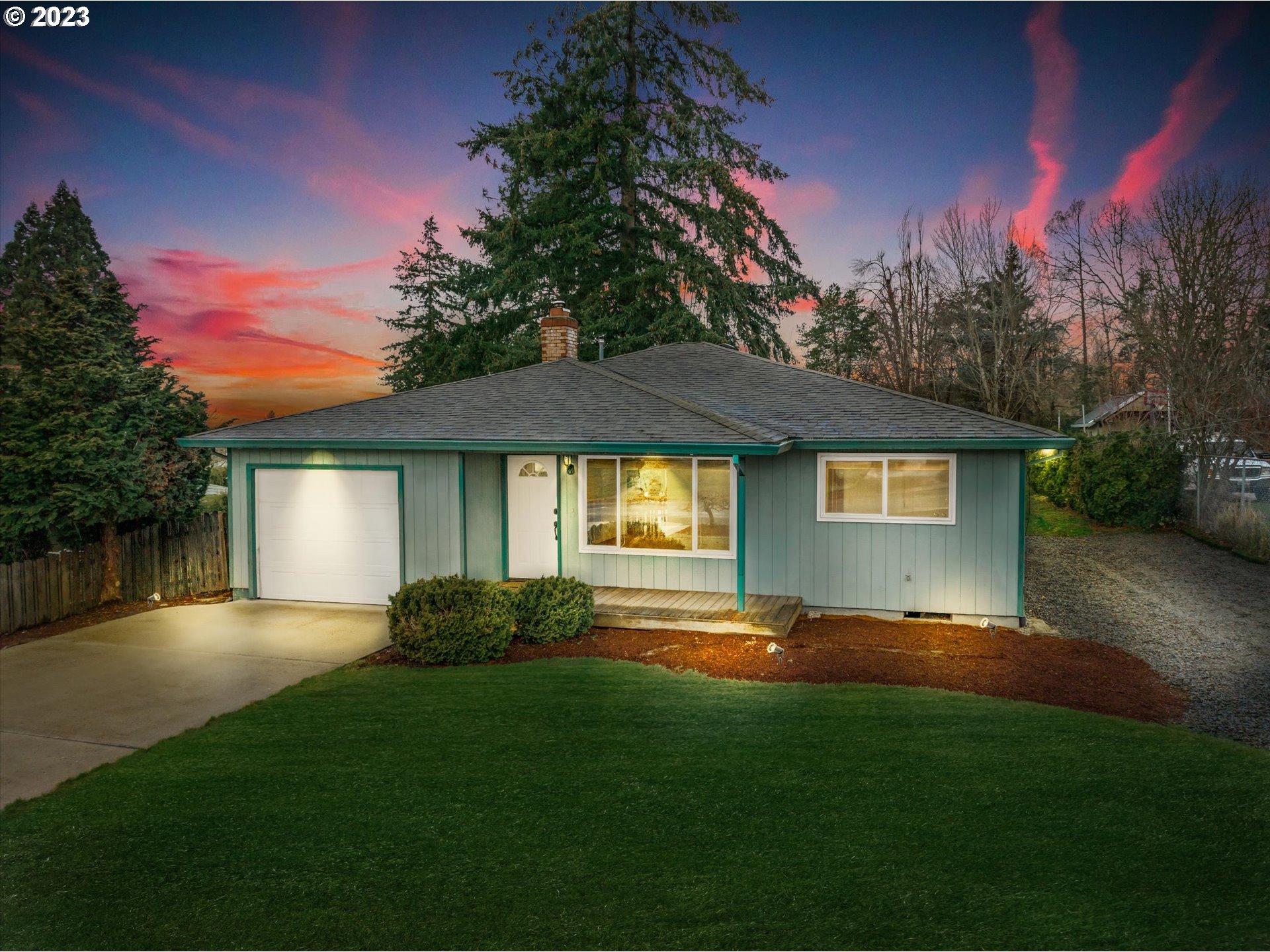 4011 Southeast View Acres Road Milwaukie, OR 97267 - Photo 1 of 19 a front view of a house with a yard and trees