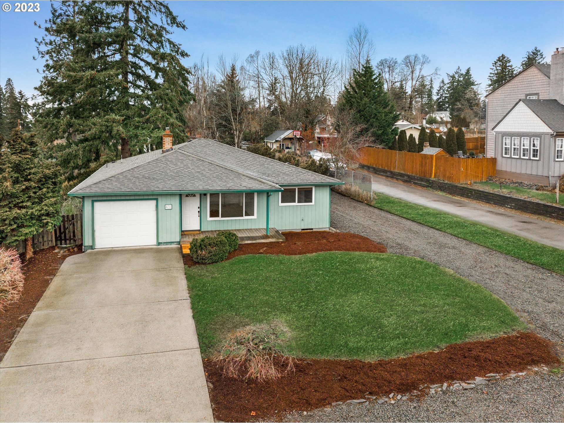 4011 Southeast View Acres Road Milwaukie, OR 97267 - Photo 4 of 19 a front view of a house with a yard