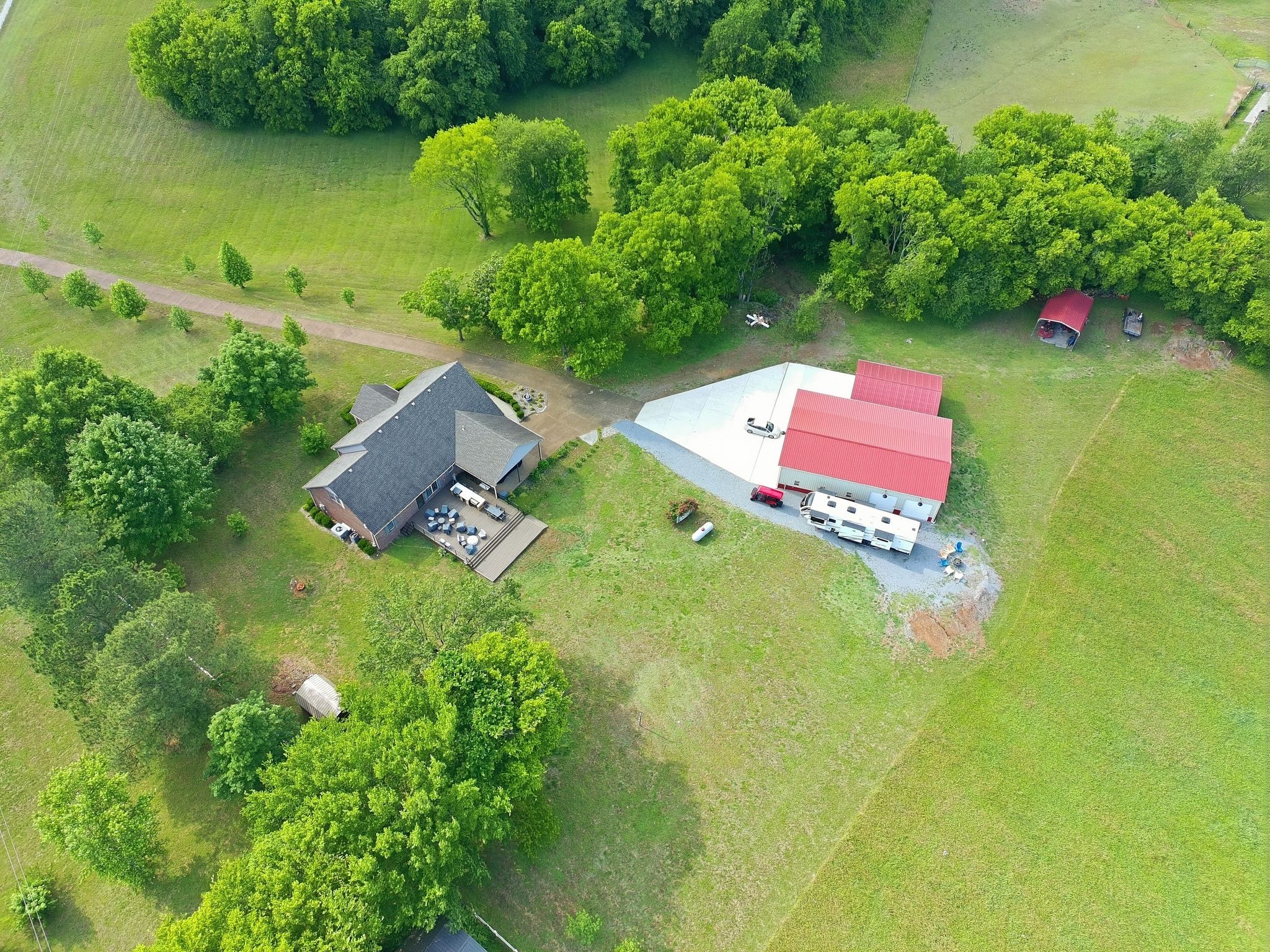 1150 Cochran Cemetery Road Lewisburg, TN 37091 - Photo 59 of 63 an aerial view of a house with pool a yard and lake view