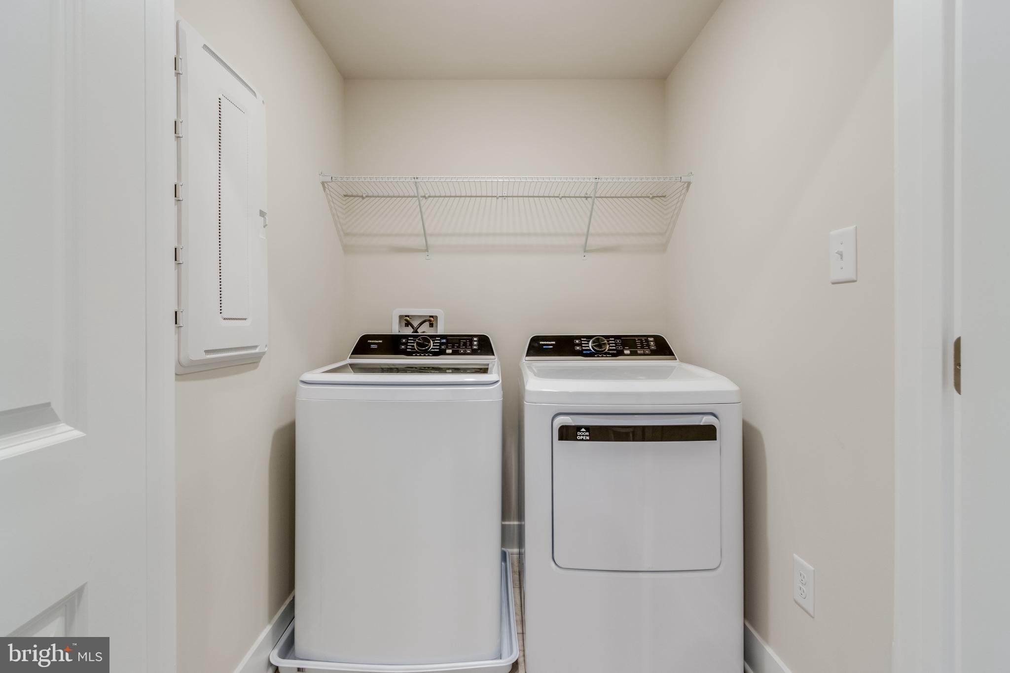 31325 Taywood Drive, Unit TH50 Frankford, DE 19945 - Photo 12 of 31 a view of storage and utility room with washer and dryer