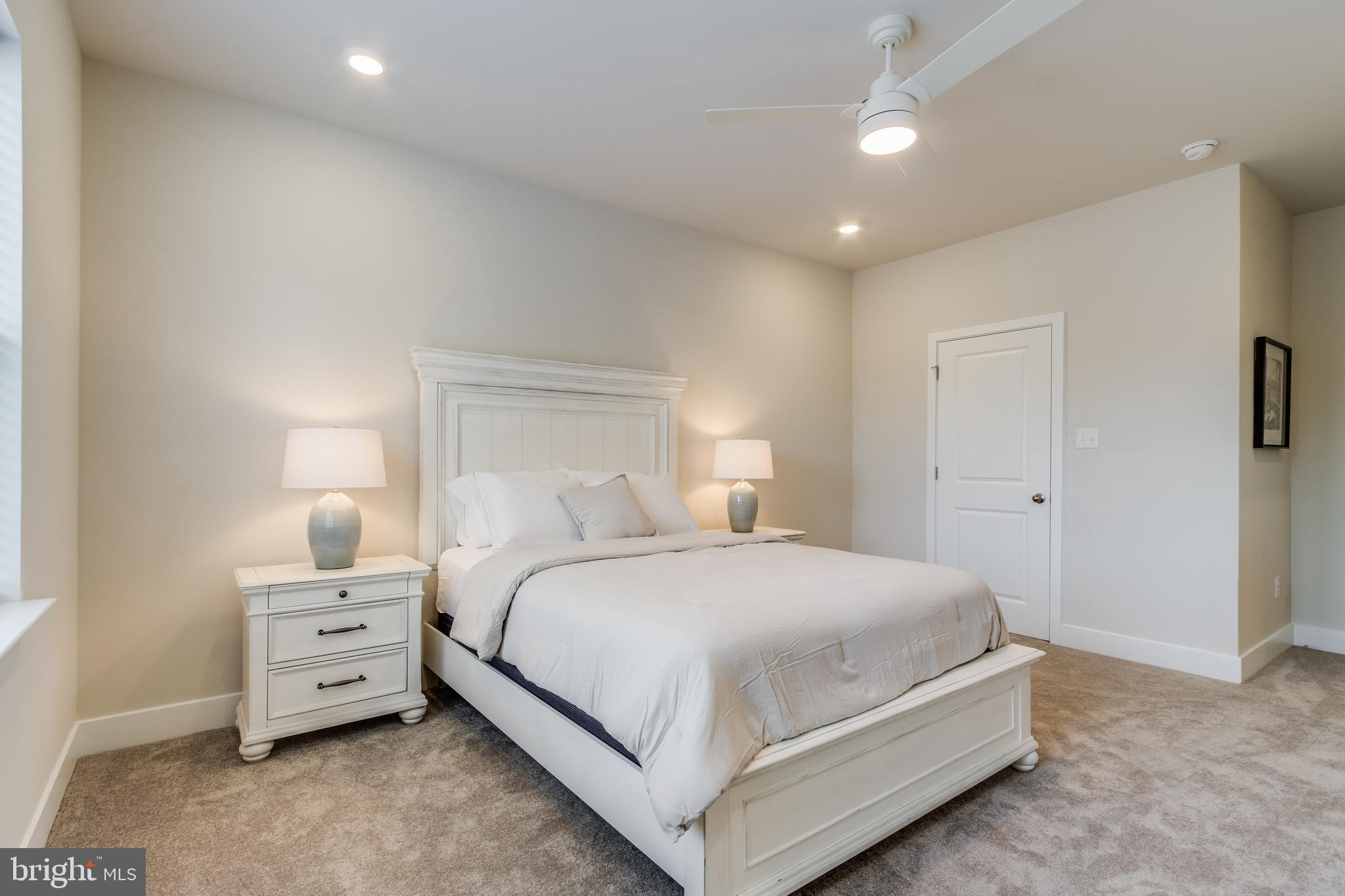 31325 Taywood Drive, Unit TH50 Frankford, DE 19945 - Photo 29 of 31 a bedroom with a bed and a night stand