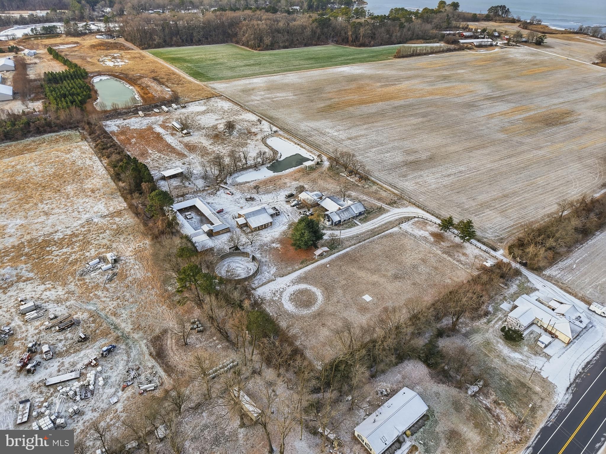 20915 Dover Bridge Road Preston, MD 21655 - Photo 6 of 60 an aerial view of a house with a yard and lake view