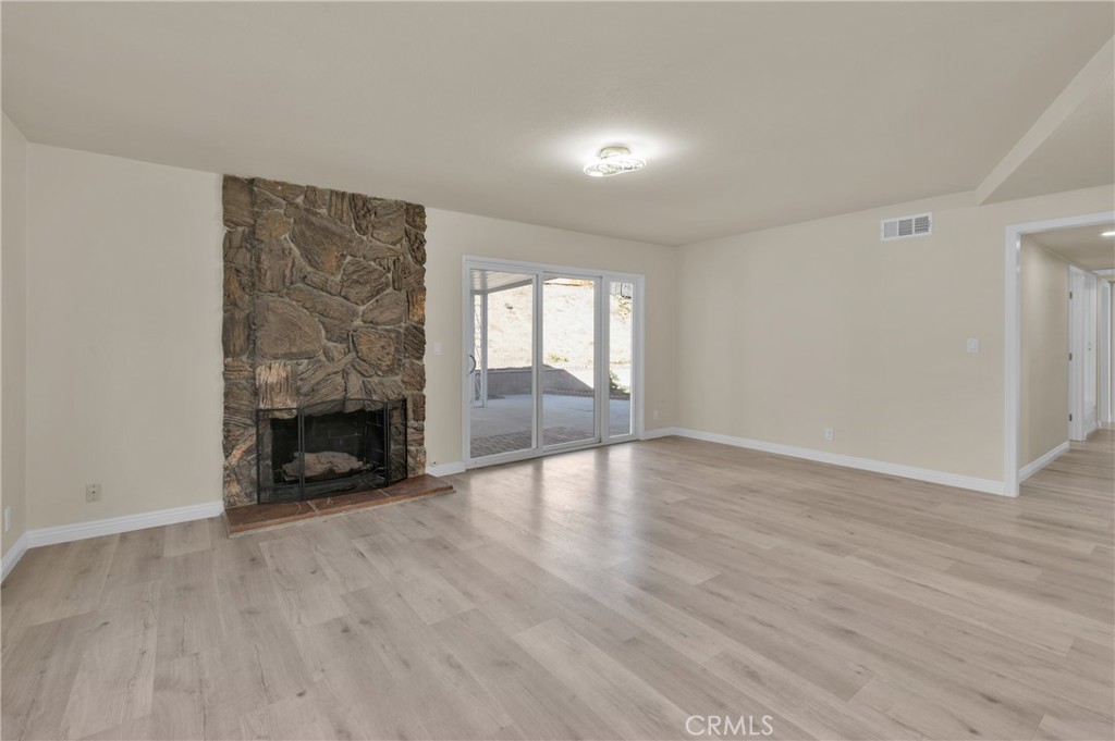 20537 East Vejar Road Walnut, CA 91789 - Photo 11 of 34 wooden floor in an empty room with a fireplace