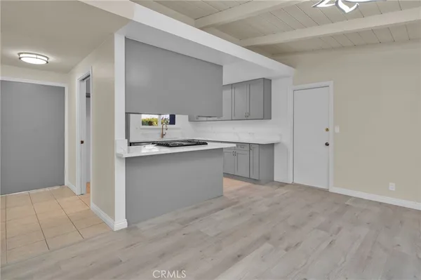a view of kitchen with cabinets and wooden floor