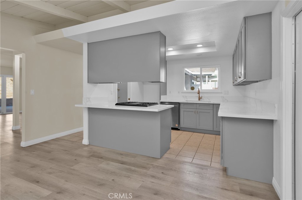 20537 East Vejar Road Walnut, CA 91789 - Photo 15 of 34 a kitchen with granite countertop a sink and a stove top oven