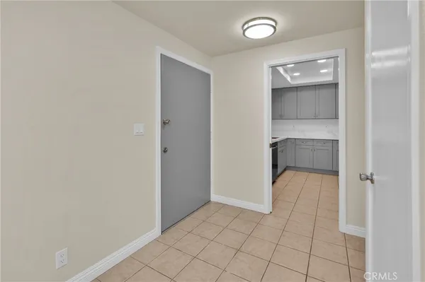 a view of an empty room with a bathroom