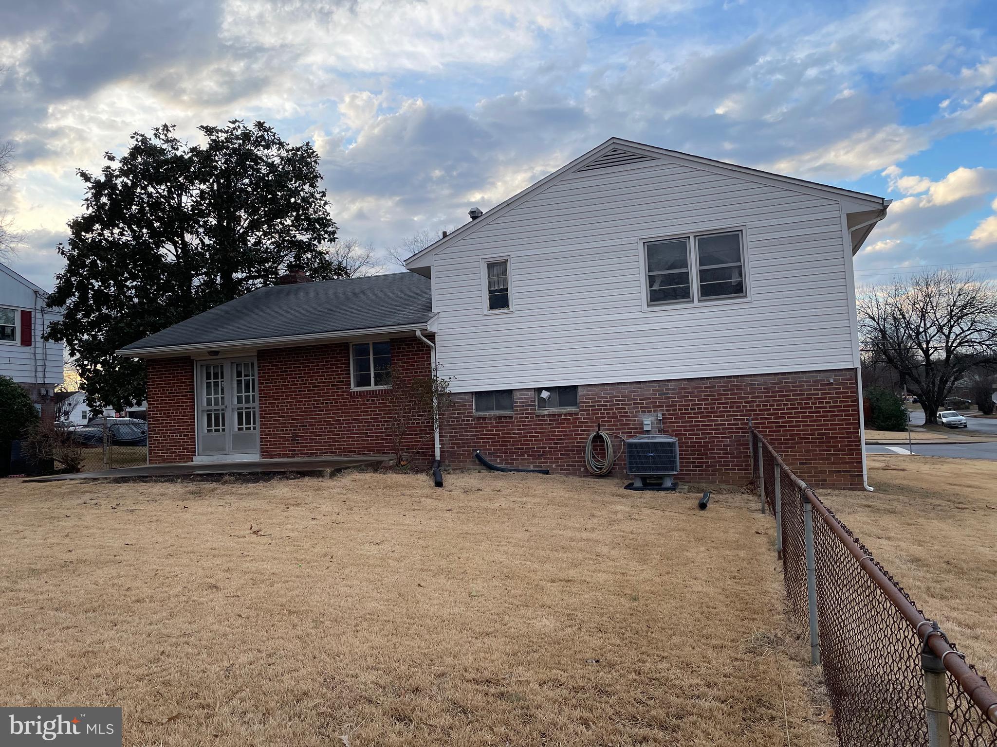 5409 Montgomery Street Springfield, VA 22151 - Photo 3 of 8 a view of a house with a backyard