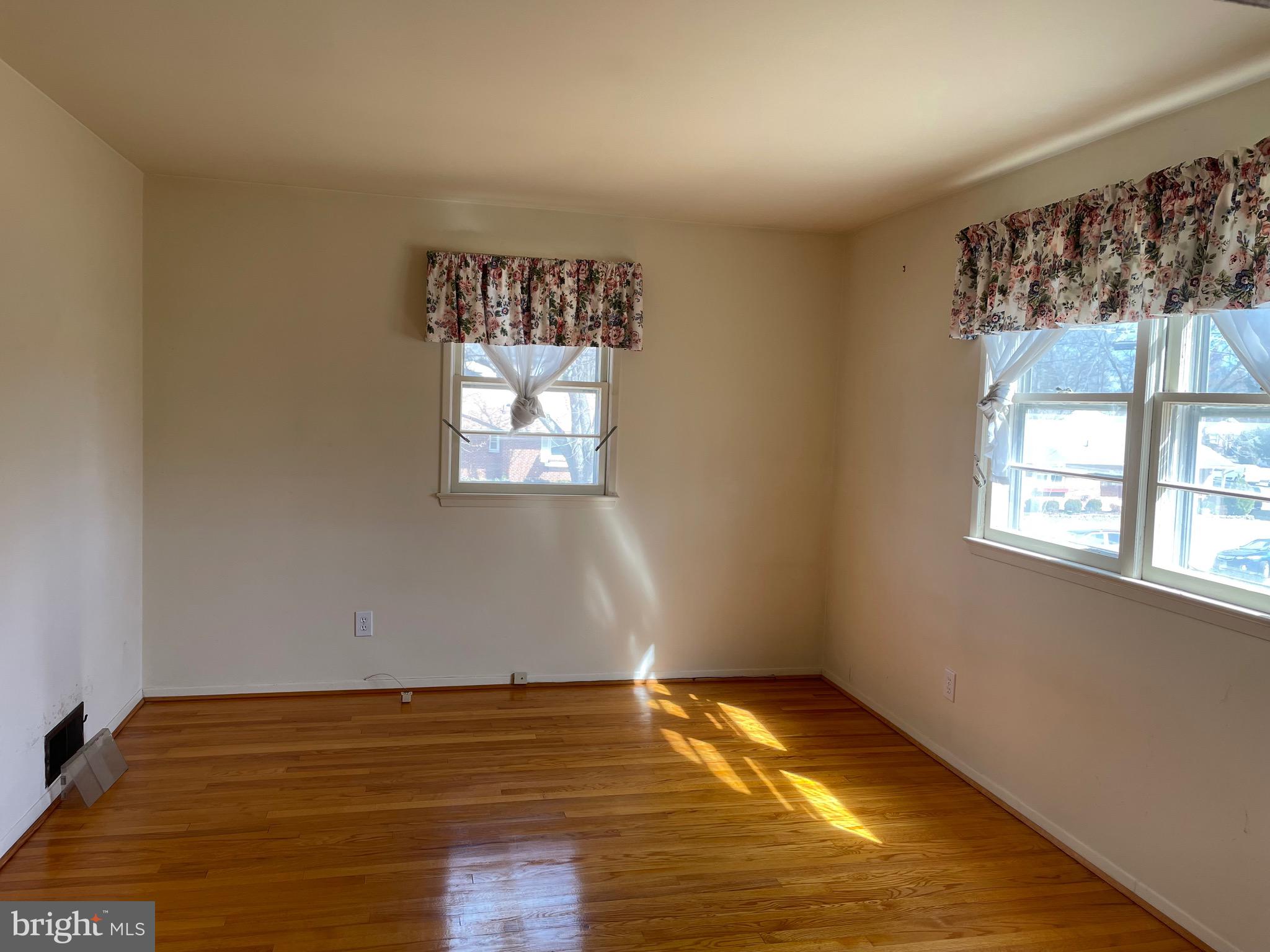 5409 Montgomery Street Springfield, VA 22151 - Photo 7 of 8 a view of empty room with wooden floor and fan