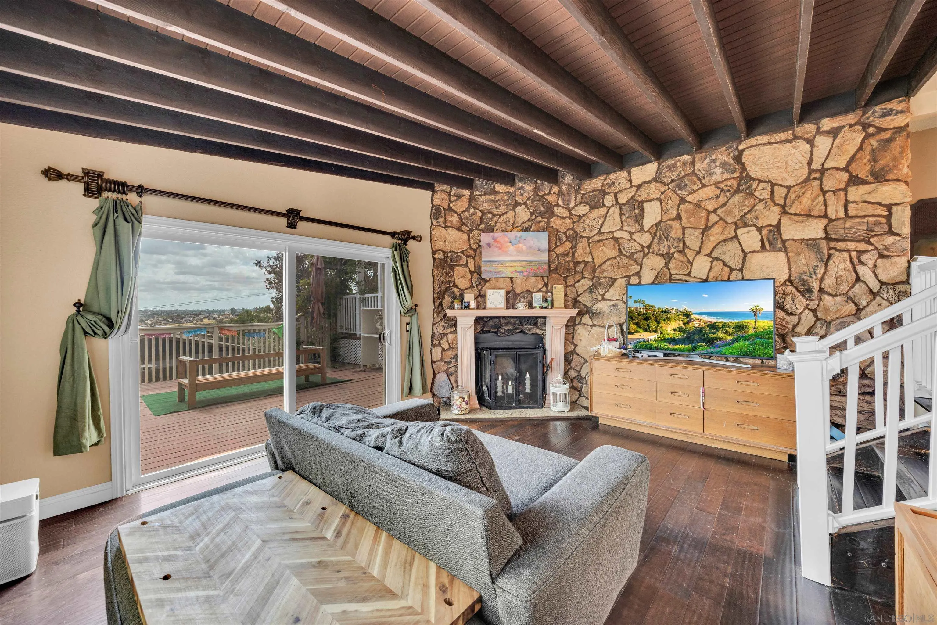 1302 Paraiso Avenue Spring Valley, CA 91977 - Photo 12 of 34 a living room with furniture and a fireplace