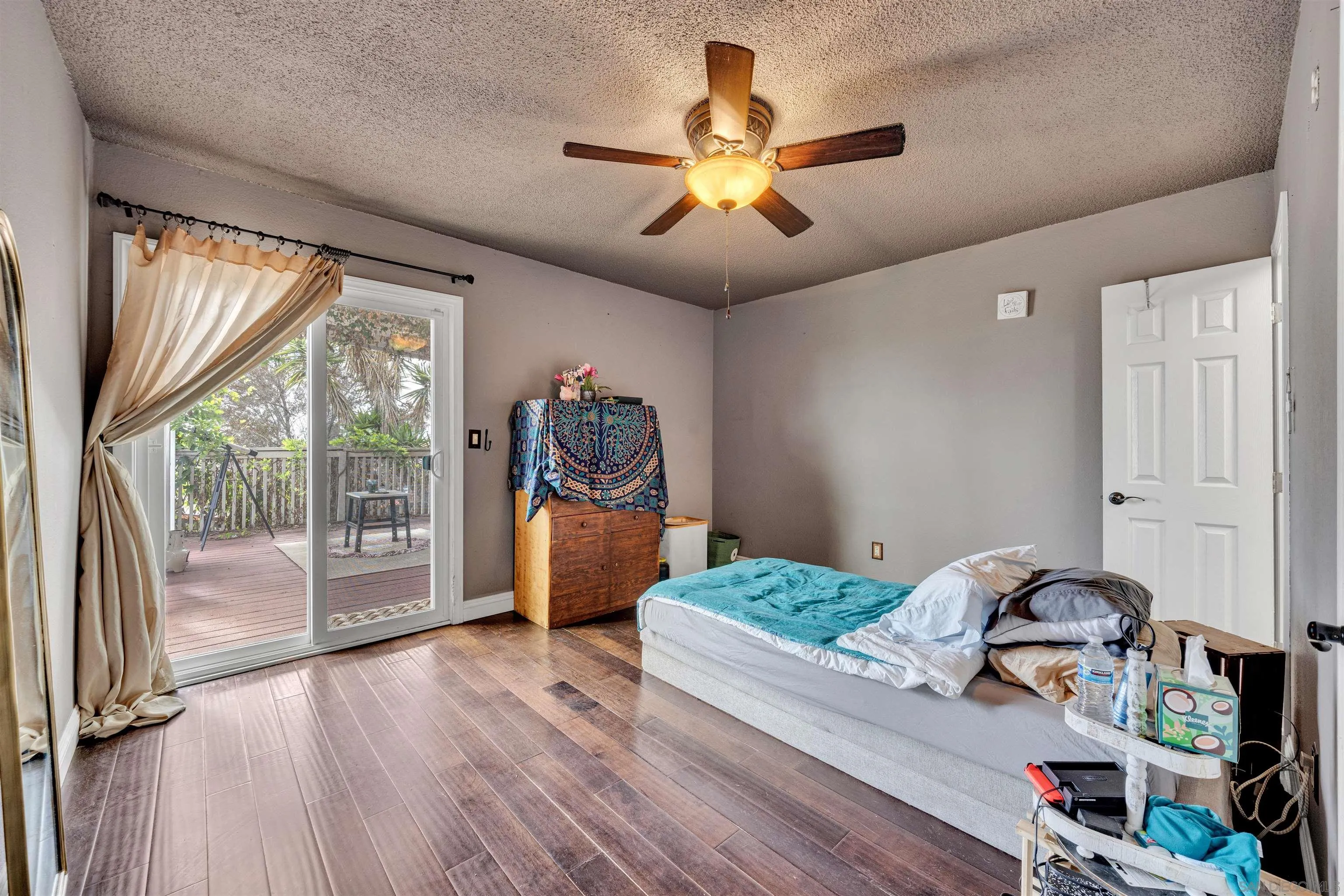 1302 Paraiso Avenue Spring Valley, CA 91977 - Photo 13 of 34 a living room with furniture and a large window