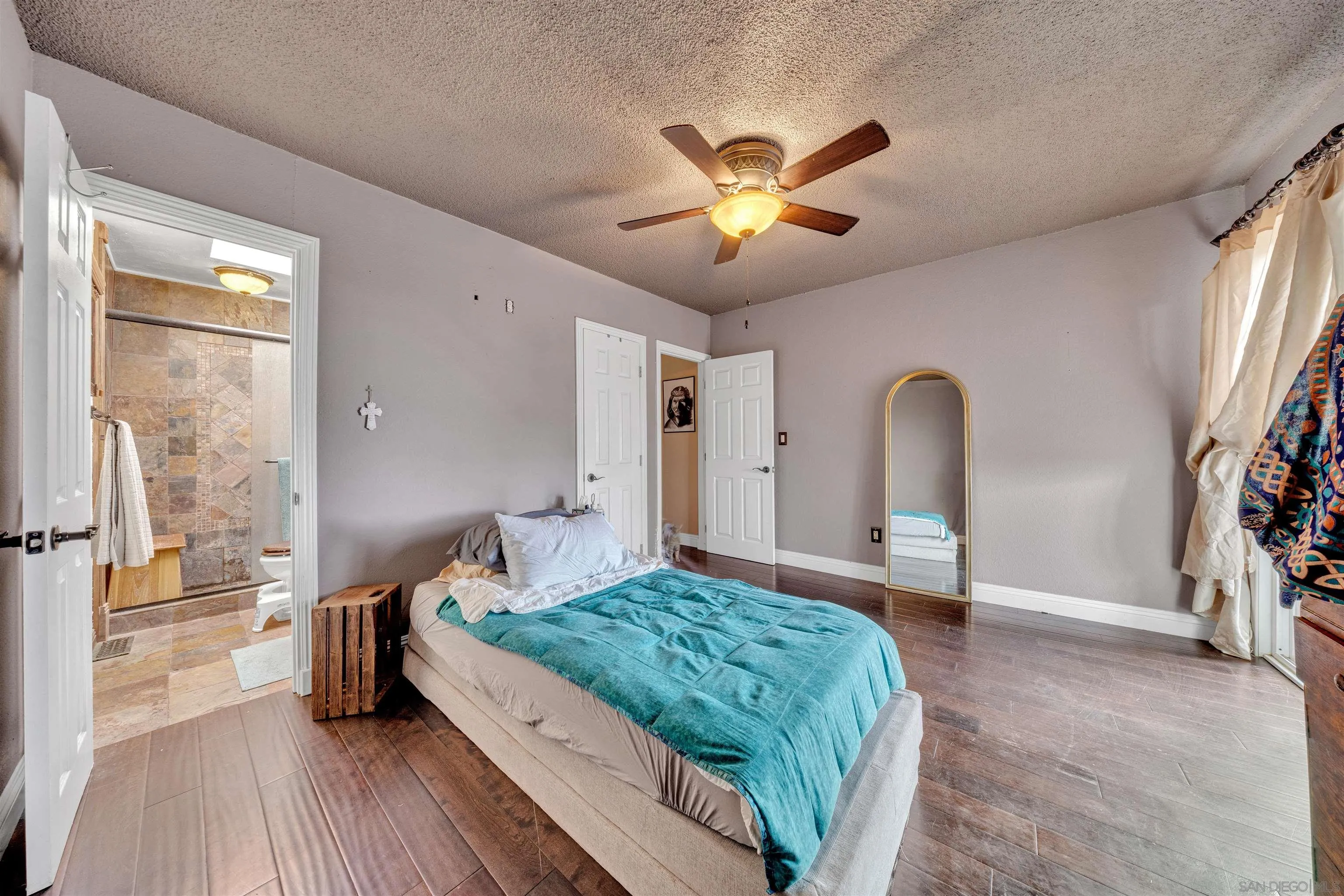 1302 Paraiso Avenue Spring Valley, CA 91977 - Photo 15 of 34 a living room with a bed furniture and a large window