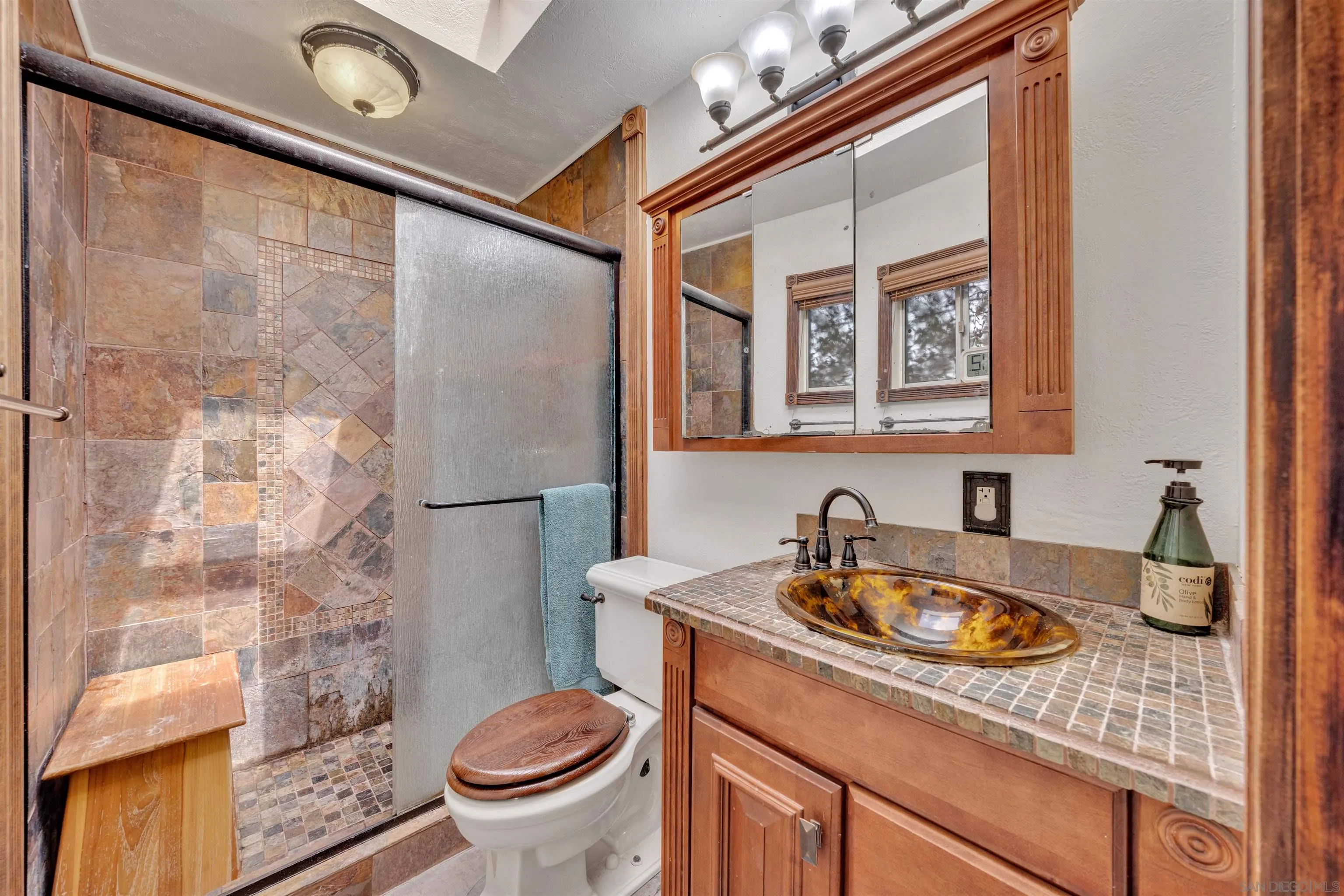 1302 Paraiso Avenue Spring Valley, CA 91977 - Photo 16 of 34 a bathroom with a sink a toilet and shower
