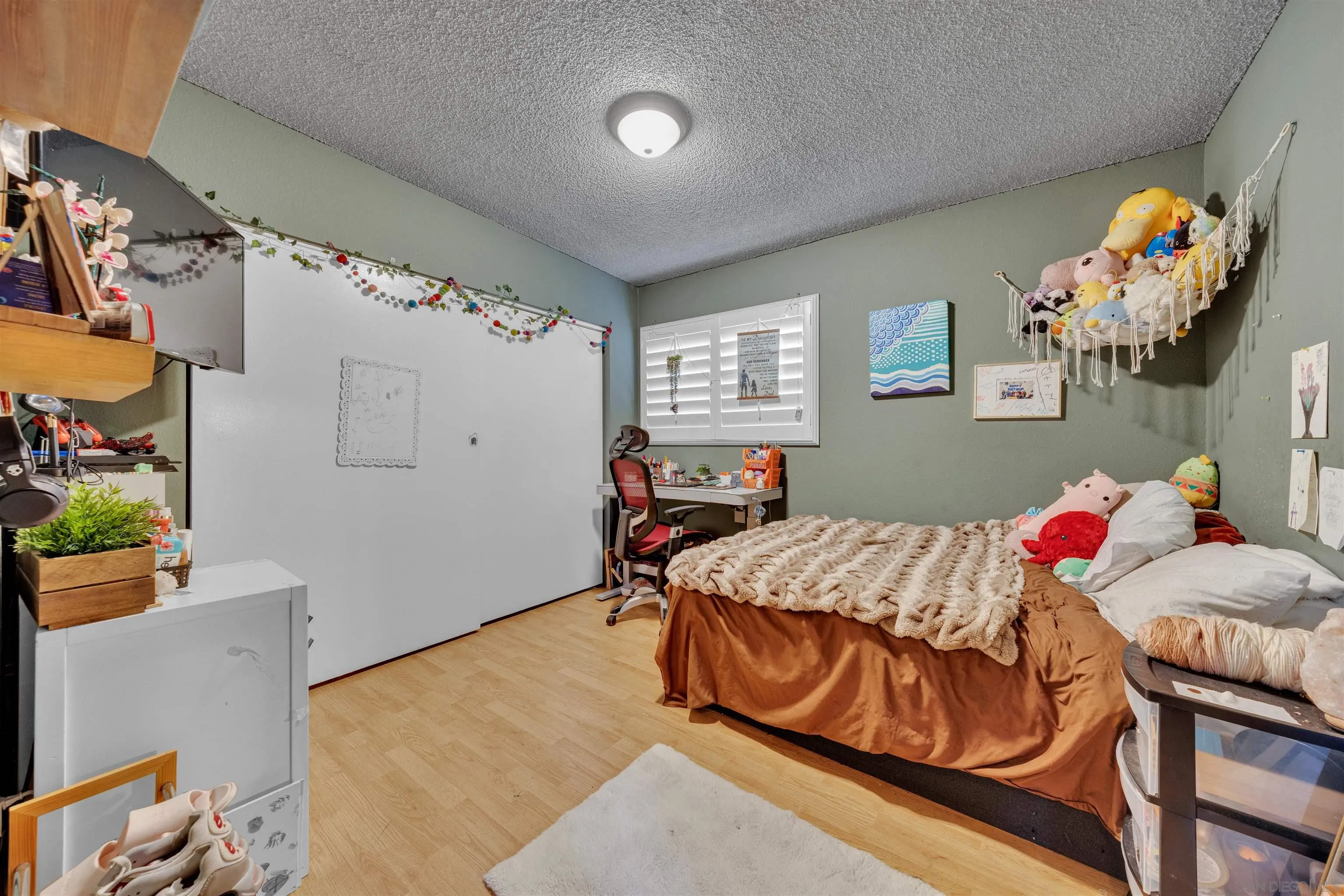 1302 Paraiso Avenue Spring Valley, CA 91977 - Photo 17 of 34 a bedroom with a bed and window