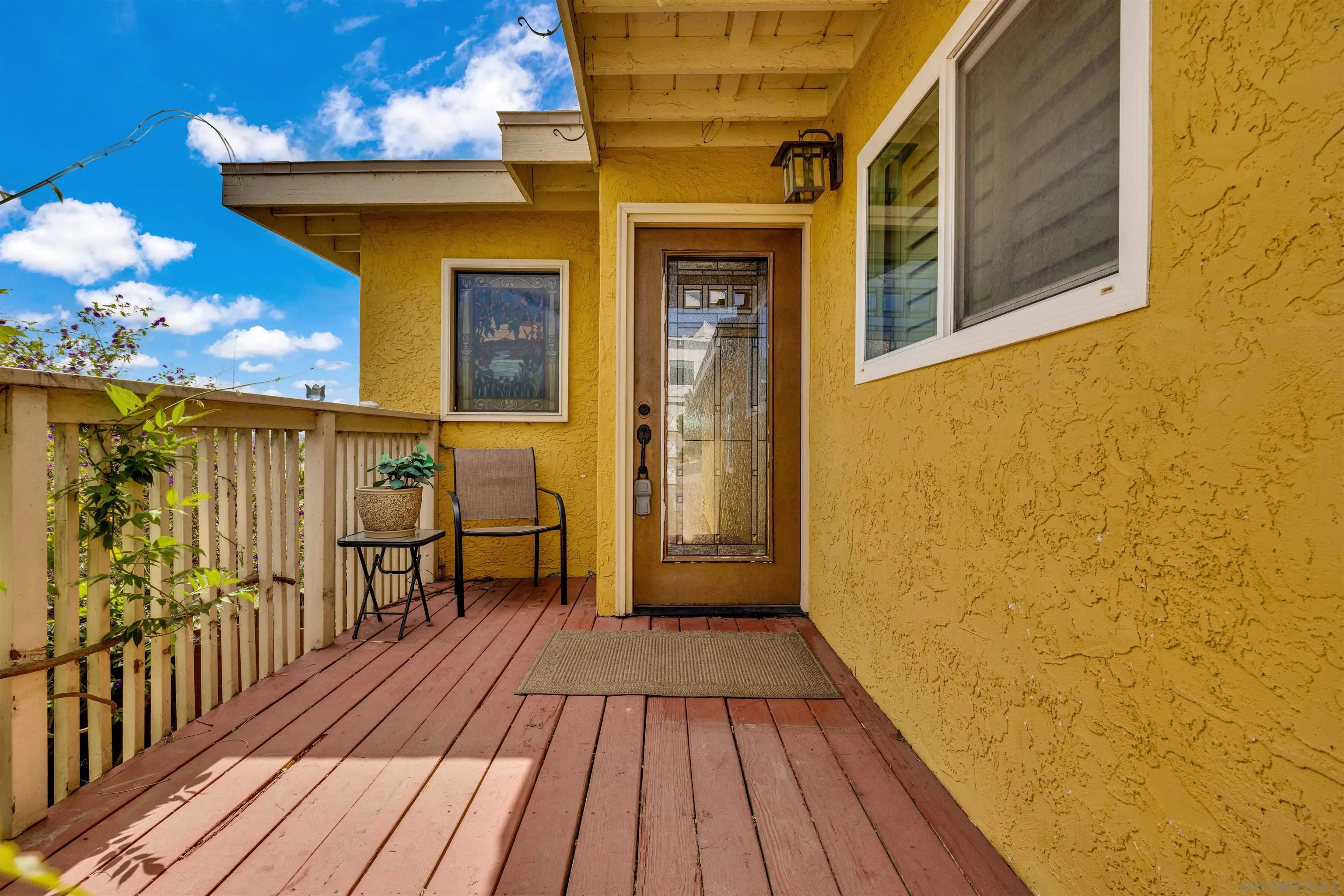 1302 Paraiso Avenue Spring Valley, CA 91977 - Photo 4 of 34 a view of a balcony with wooden floor and furniture