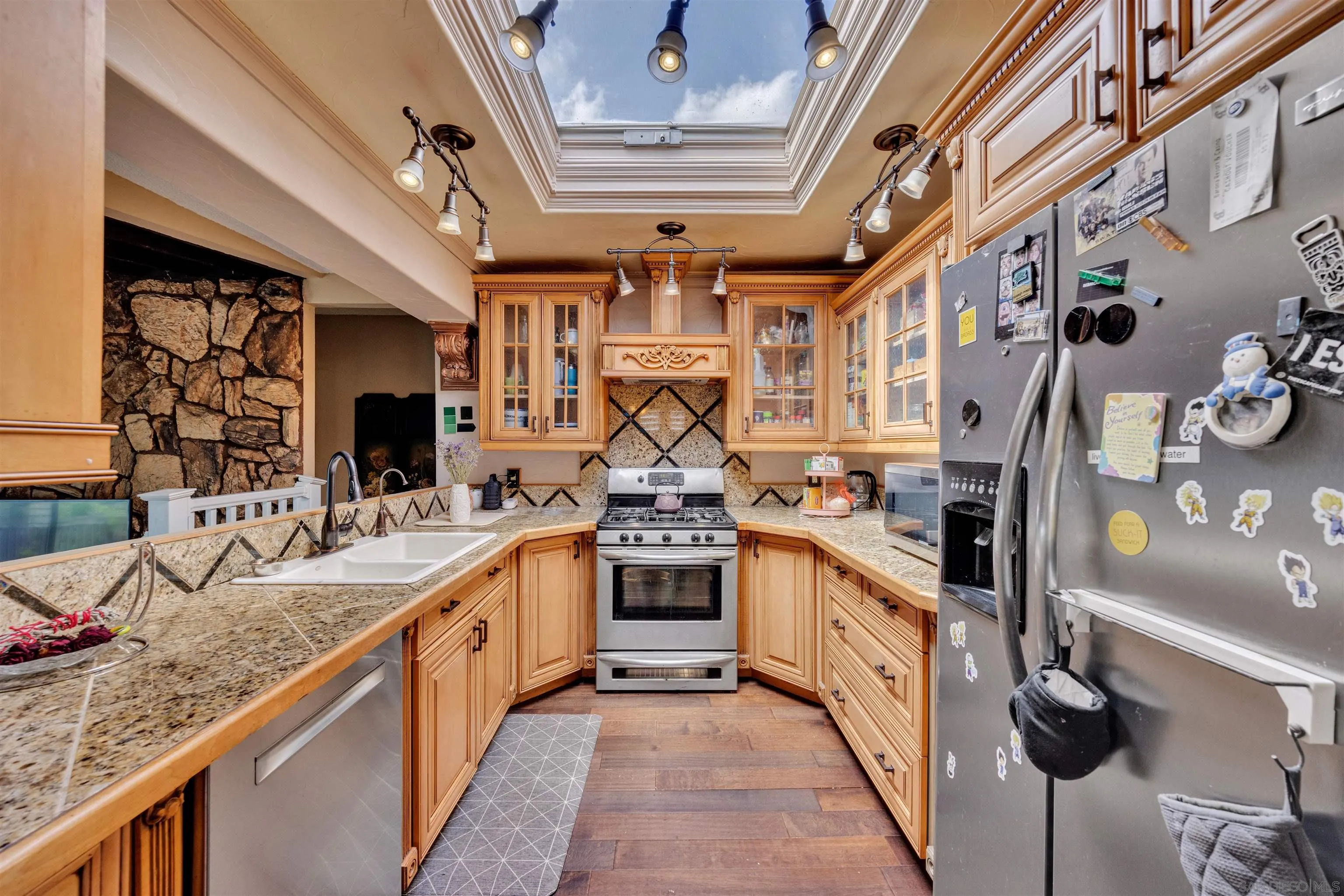 1302 Paraiso Avenue Spring Valley, CA 91977 - Photo 6 of 34 a large kitchen with stainless steel appliances granite countertop lots of counter top space