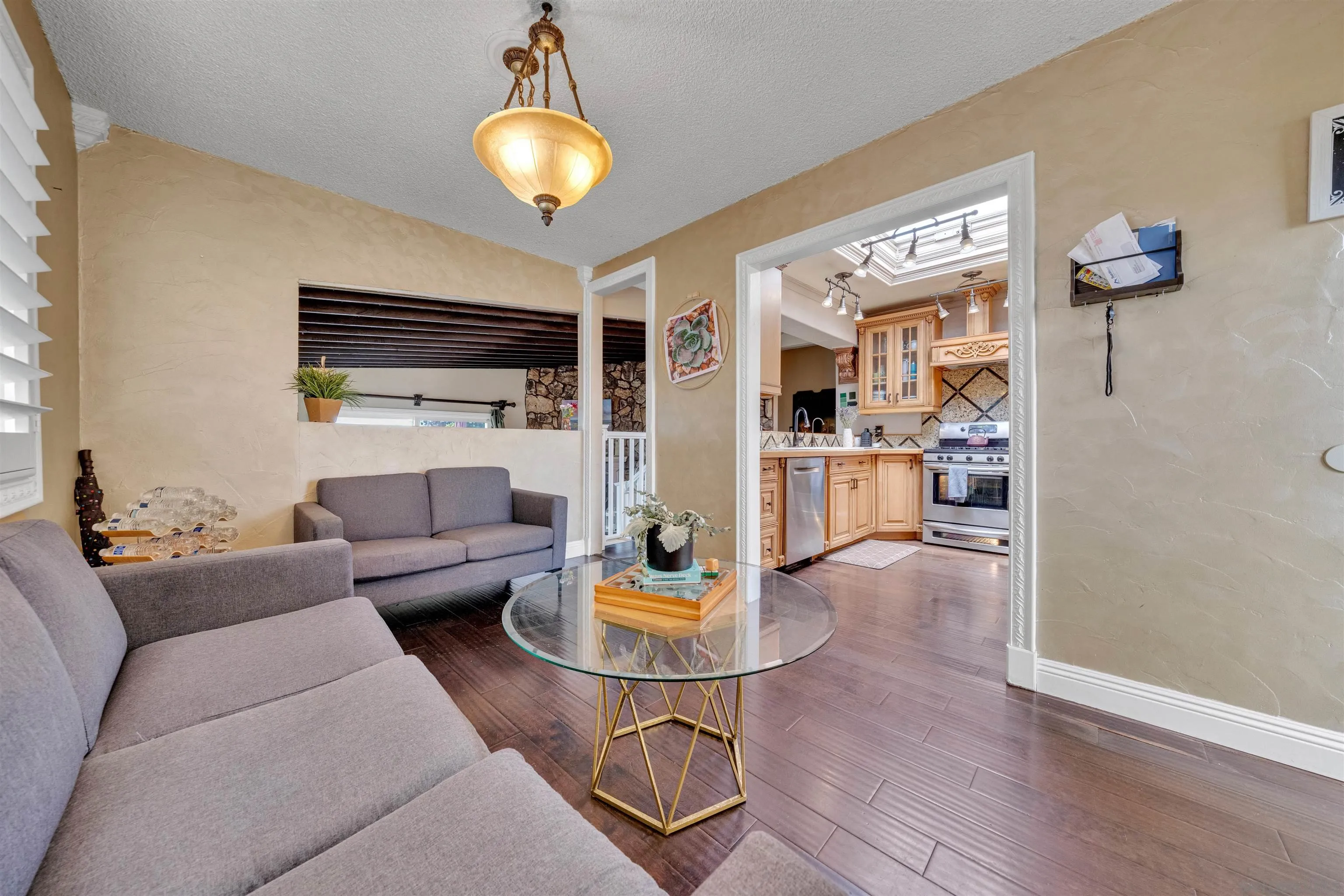 1302 Paraiso Avenue Spring Valley, CA 91977 - Photo 7 of 34 a living room with furniture and a wooden floor
