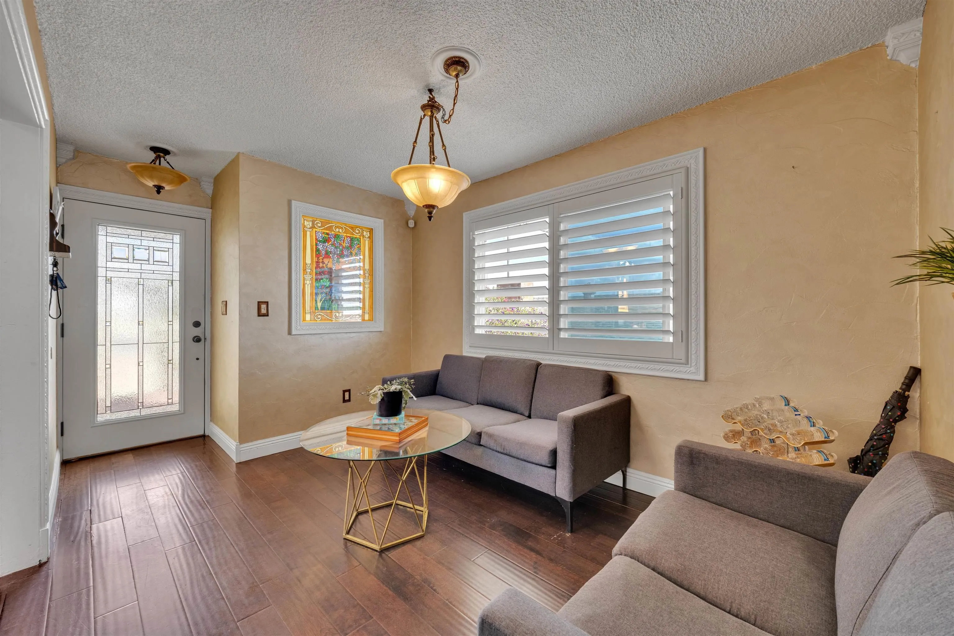 1302 Paraiso Avenue Spring Valley, CA 91977 - Photo 8 of 34 a living room with furniture and a window