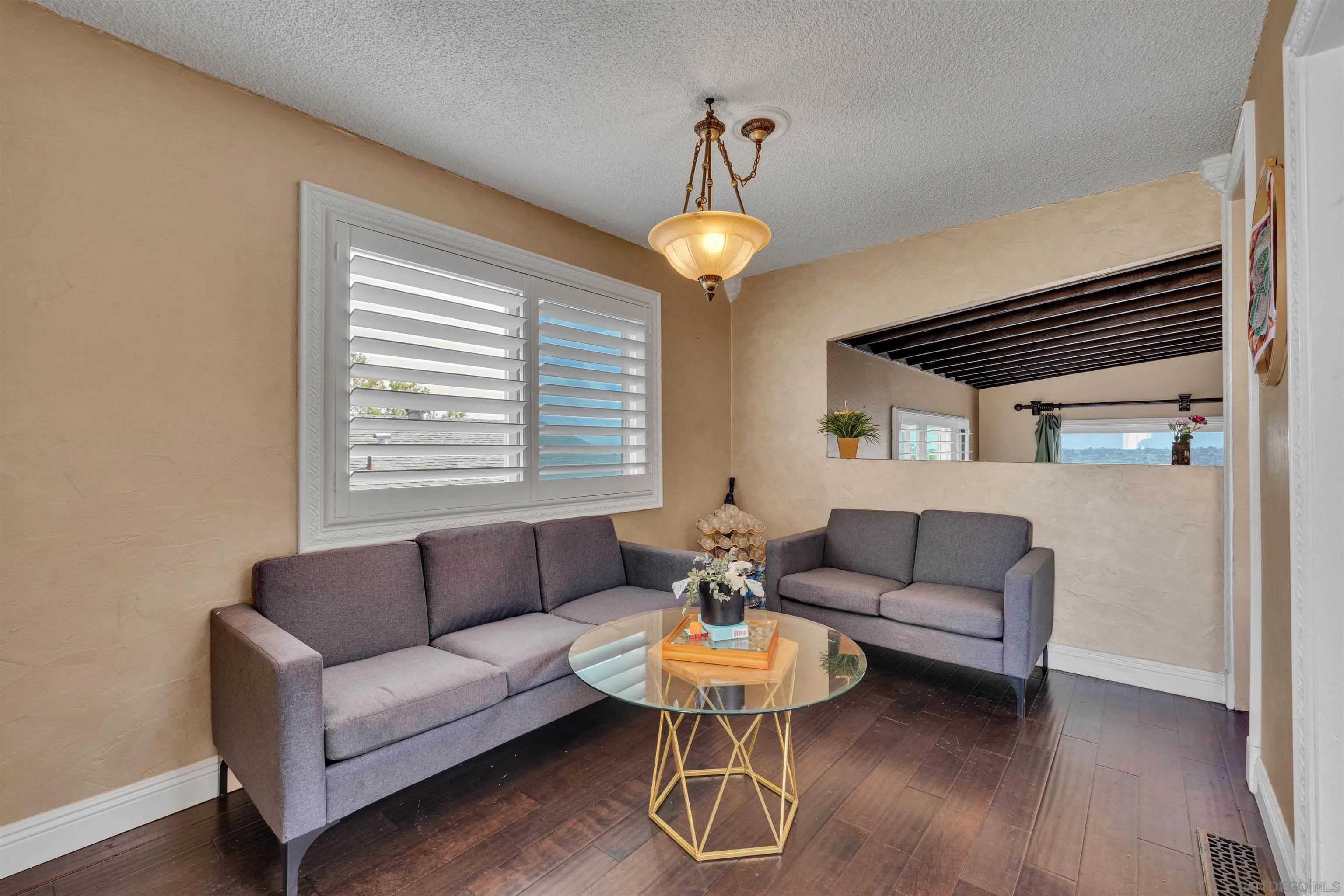 1302 Paraiso Avenue Spring Valley, CA 91977 - Photo 9 of 34 a living room with furniture and a chandelier