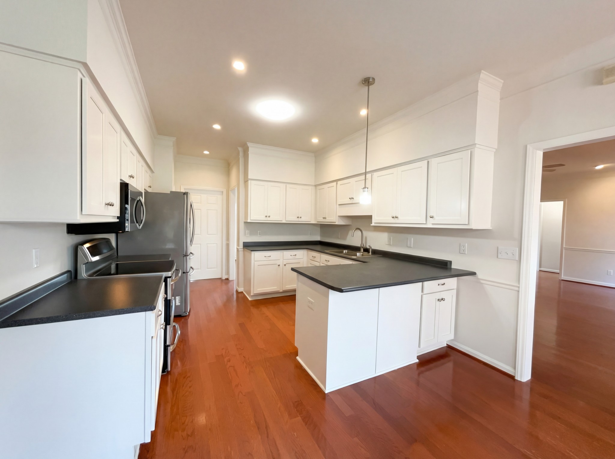 3106 Park Hill Road Murfreesboro, TN 37129 - Photo 12 of 28 a kitchen with stainless steel appliances granite countertop a sink a stove and a refrigerator