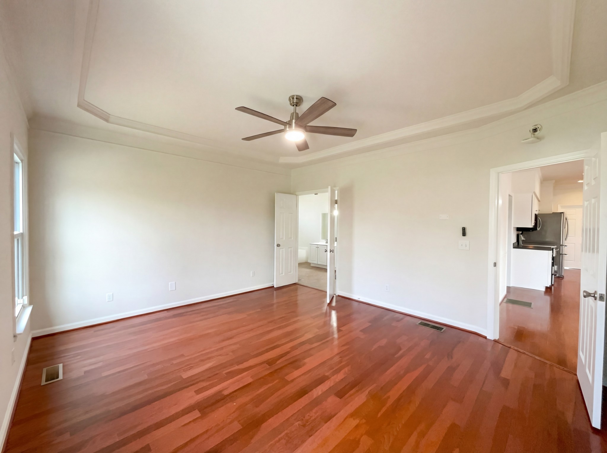 3106 Park Hill Road Murfreesboro, TN 37129 - Photo 16 of 28 an empty room with wooden floor and a ceiling fan