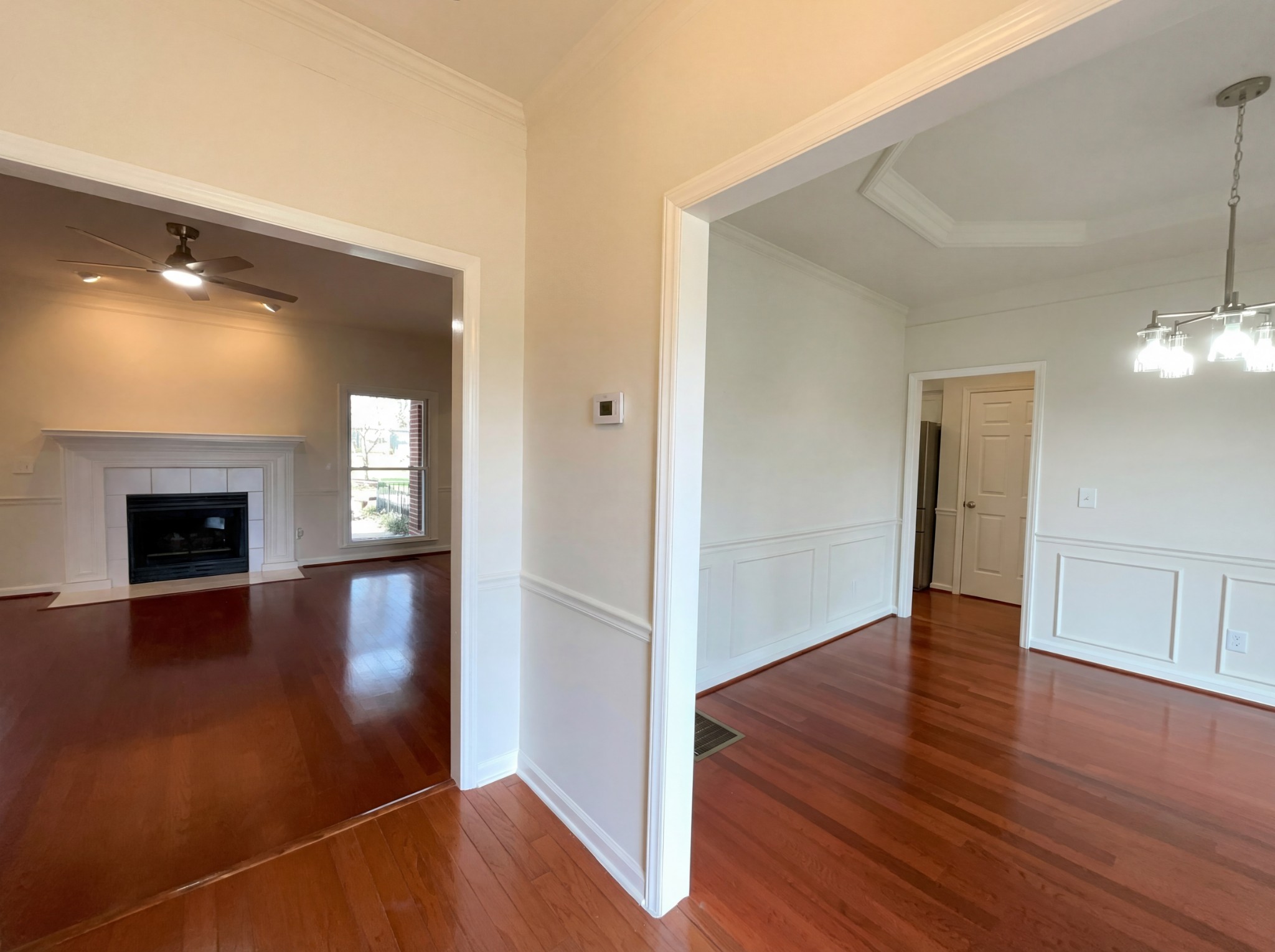 3106 Park Hill Road Murfreesboro, TN 37129 - Photo 8 of 28 an empty room with wooden floor and fireplace