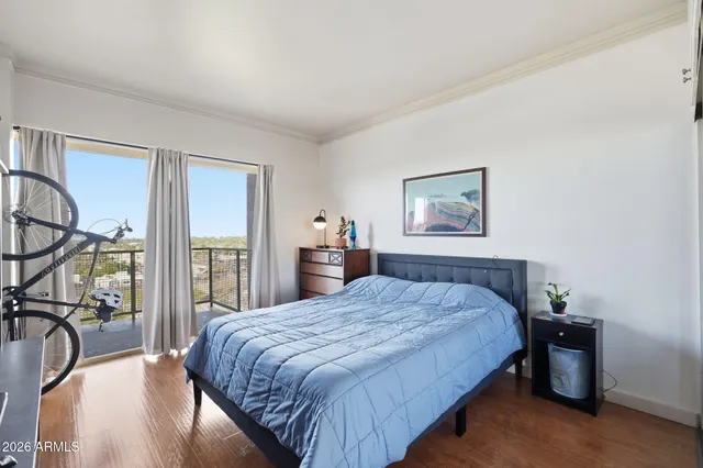 a view of a workspace with furniture and wooden floor