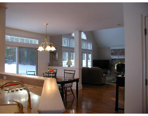 45 Amanda Road Sudbury, MA 01776 - Photo 10 of 22 a living room with furniture and a chandelier