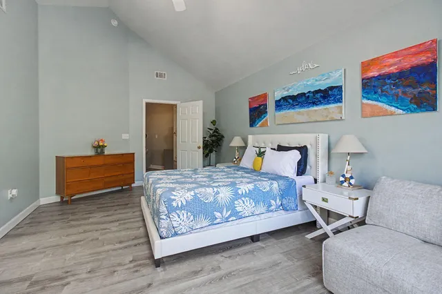 a bedroom with a bed and dresser