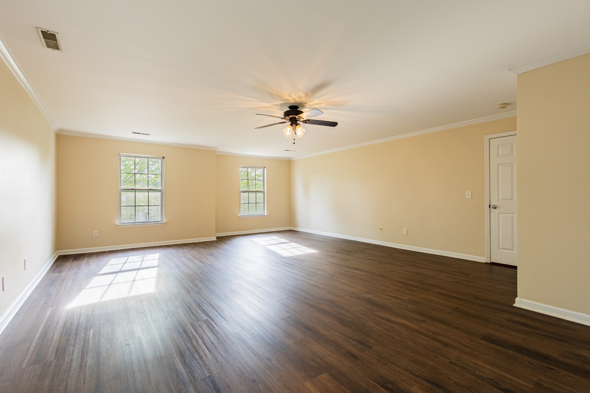 2236 Hayward Lane Spring Hill, TN 37174 - Photo 33 of 59 an empty room with wooden floor fan and windows