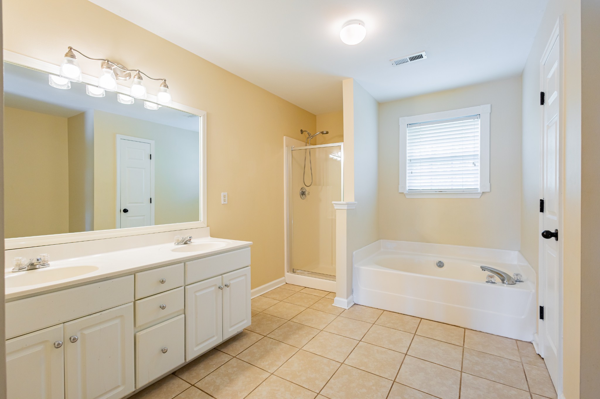 2236 Hayward Lane Spring Hill, TN 37174 - Photo 35 of 59 a spacious bathroom with a tub sink mirror and