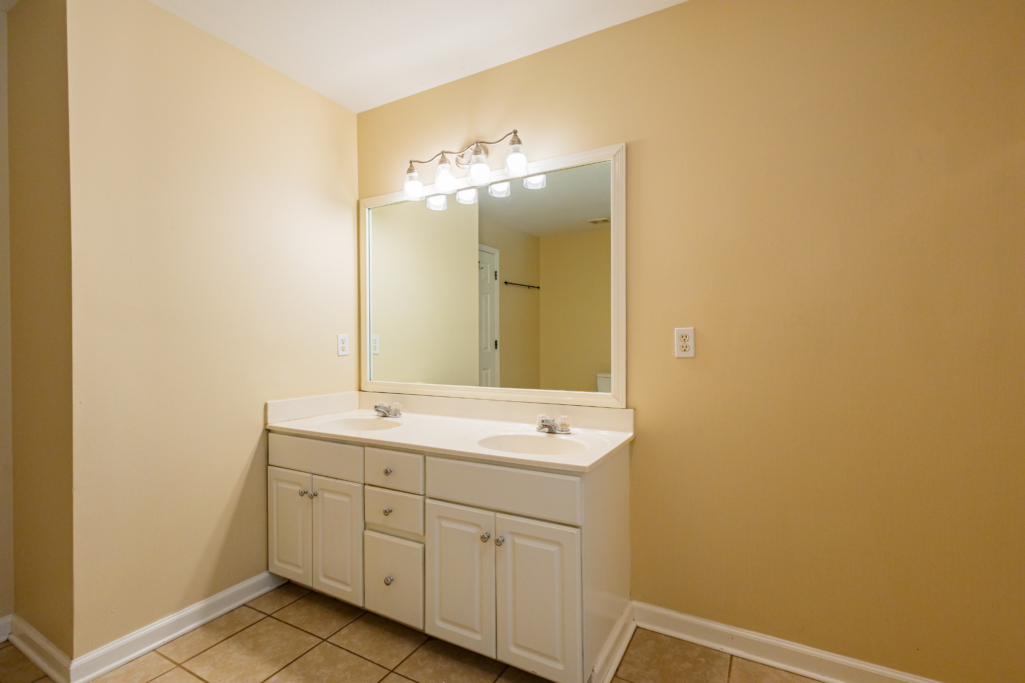 2236 Hayward Lane Spring Hill, TN 37174 - Photo 36 of 59 a bathroom with a double vanity sink and a mirror