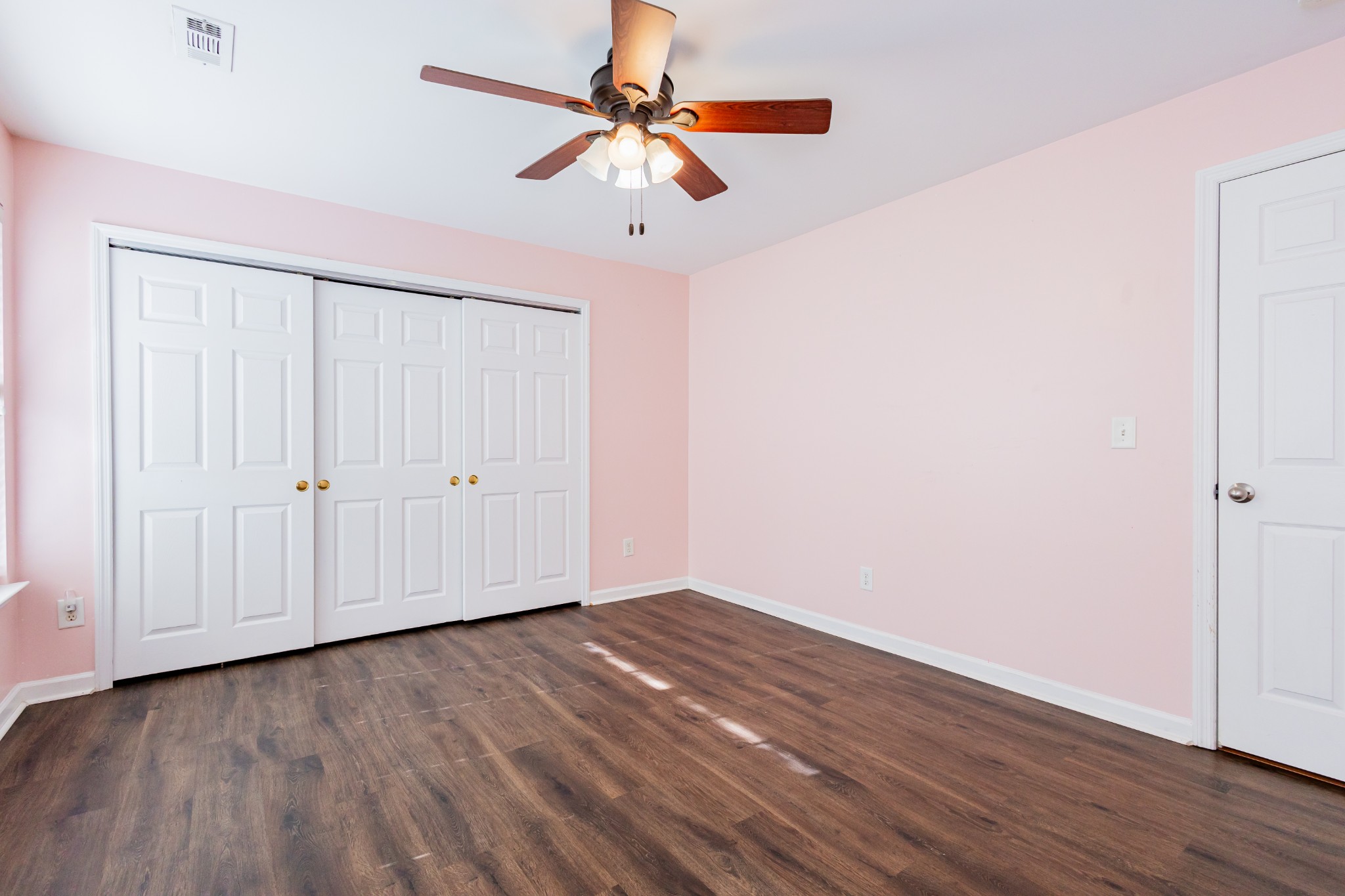 2236 Hayward Lane Spring Hill, TN 37174 - Photo 52 of 59 an empty room with wooden floor fan and windows