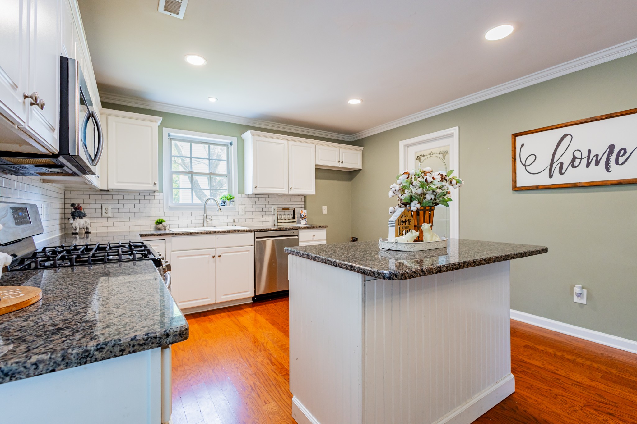 2236 Hayward Lane Spring Hill, TN 37174 - Photo 8 of 59 a kitchen with stainless steel appliances granite countertop a sink stove and cabinets