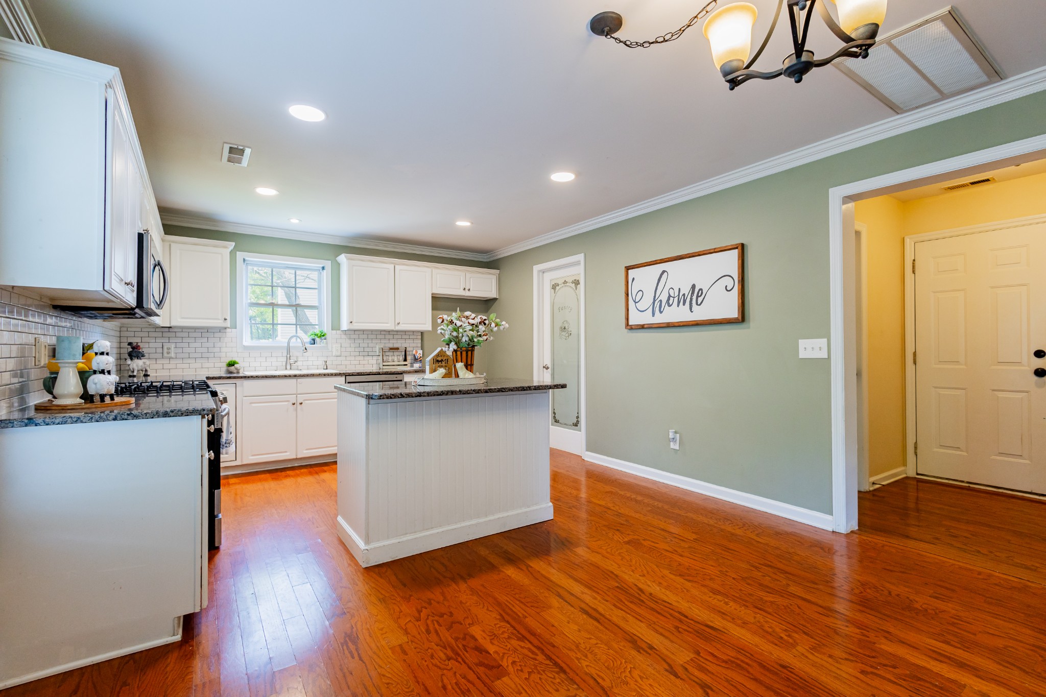 2236 Hayward Lane Spring Hill, TN 37174 - Photo 10 of 59 a kitchen with wooden floors and appliances