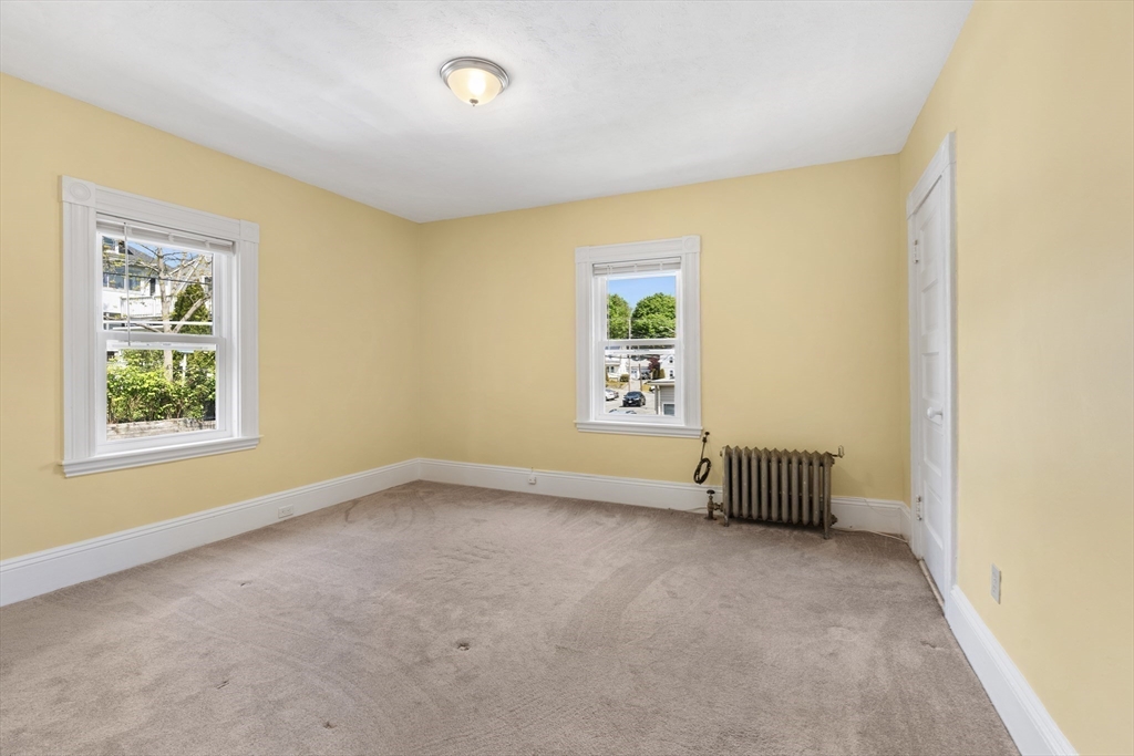 12 Folger Avenue, Unit 3 Beverly, MA 01915 - Photo 13 of 20 an empty room with windows