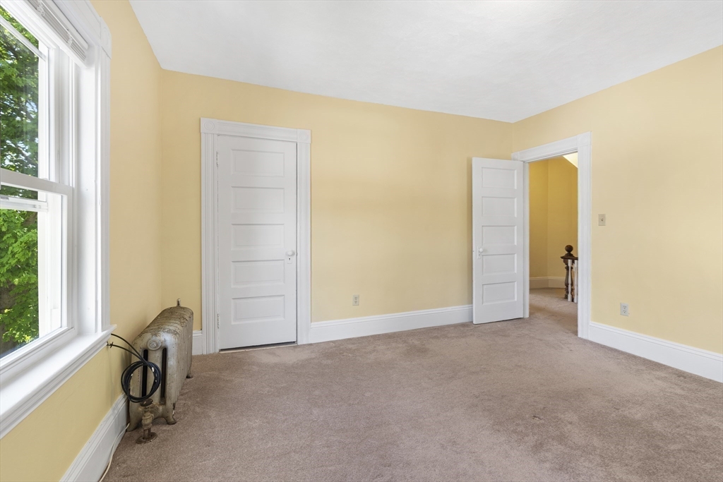 12 Folger Avenue, Unit 3 Beverly, MA 01915 - Photo 14 of 20 a view of a room with a door and a window