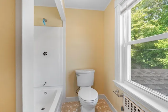 a bathroom with a toilet and a sink