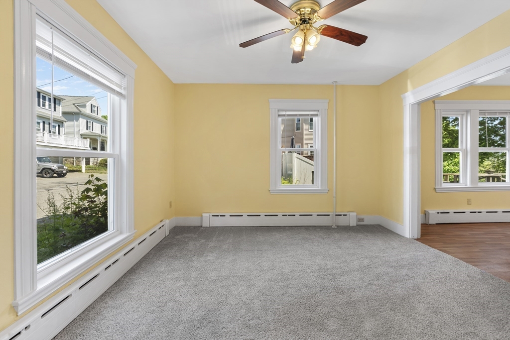 12 Folger Avenue, Unit 3 Beverly, MA 01915 - Photo 2 of 20 an empty room with windows and fan view