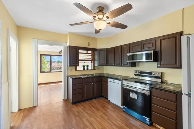 a kitchen with stainless steel appliances granite countertop a stove and a sink