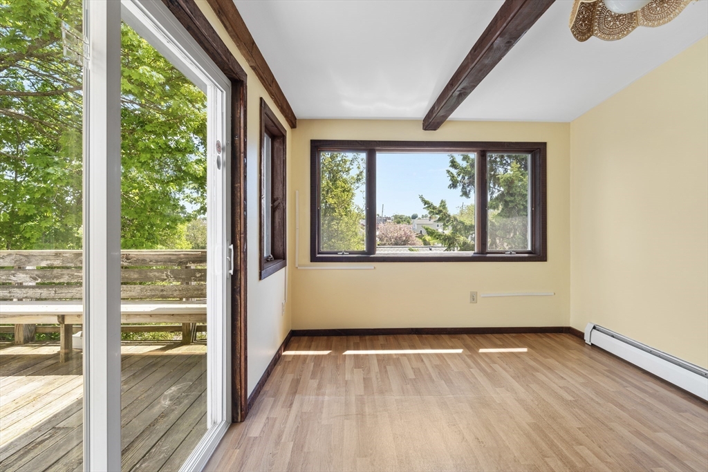 12 Folger Avenue, Unit 3 Beverly, MA 01915 - Photo 7 of 20 wooden floor in an empty room with a window
