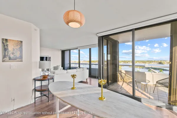 a view of a bedroom with furniture and wooden floor