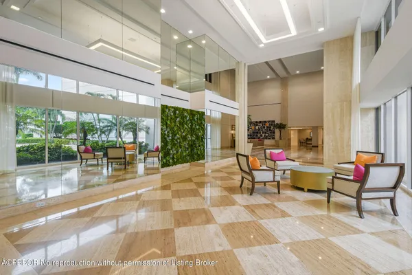 a view of a terrace with lawn chairs and iron fence