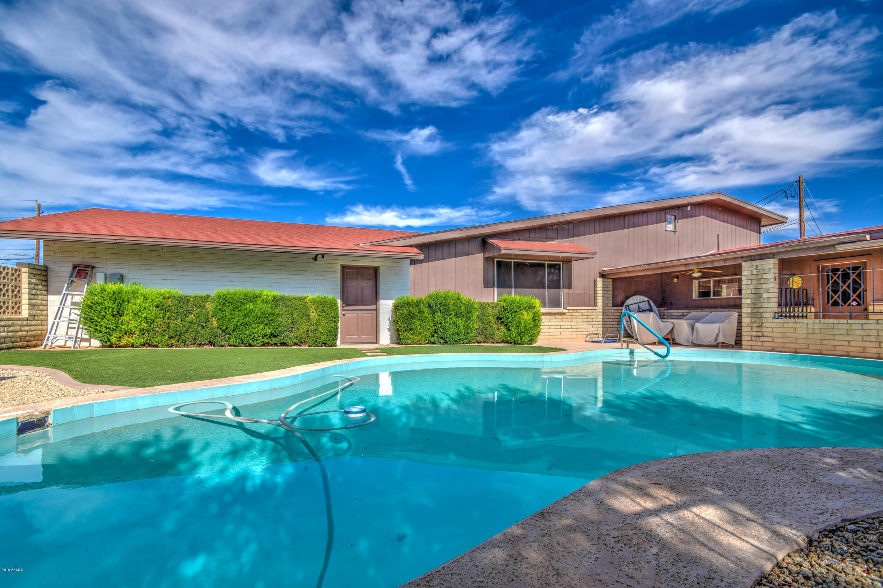 256 North Apache Road Buckeye, AZ 85326 - Photo 49 of 53 Artificial turf near pool