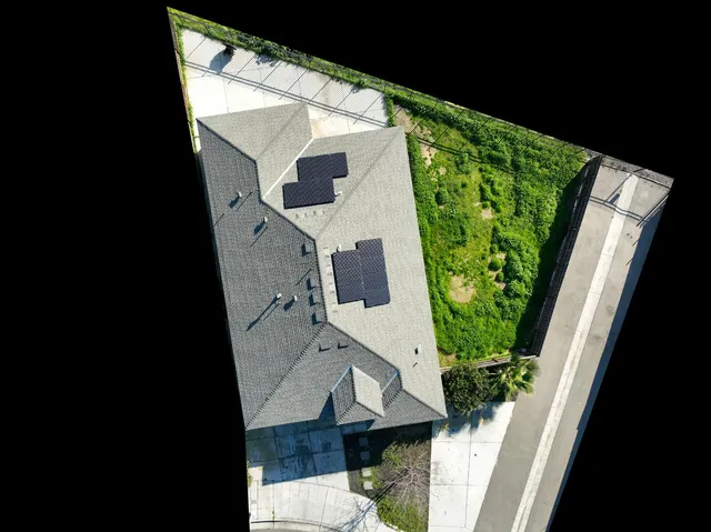 an aerial view of a house with garden