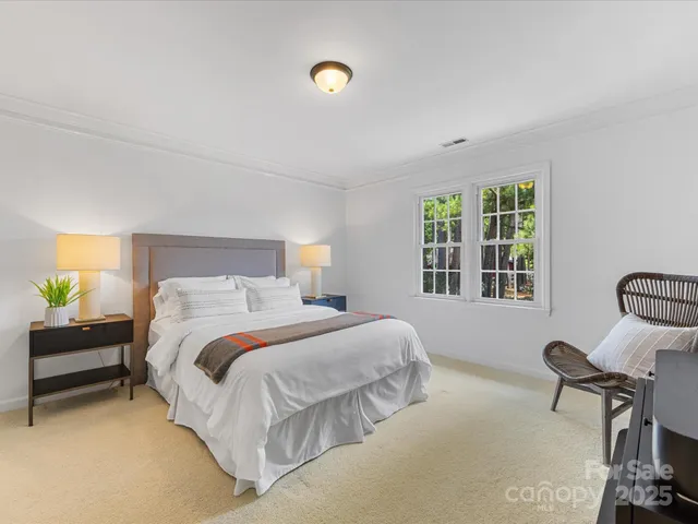 a bedroom with a bed and a table