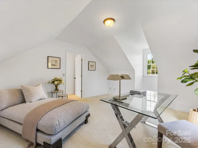 a bedroom with a bed and a desk