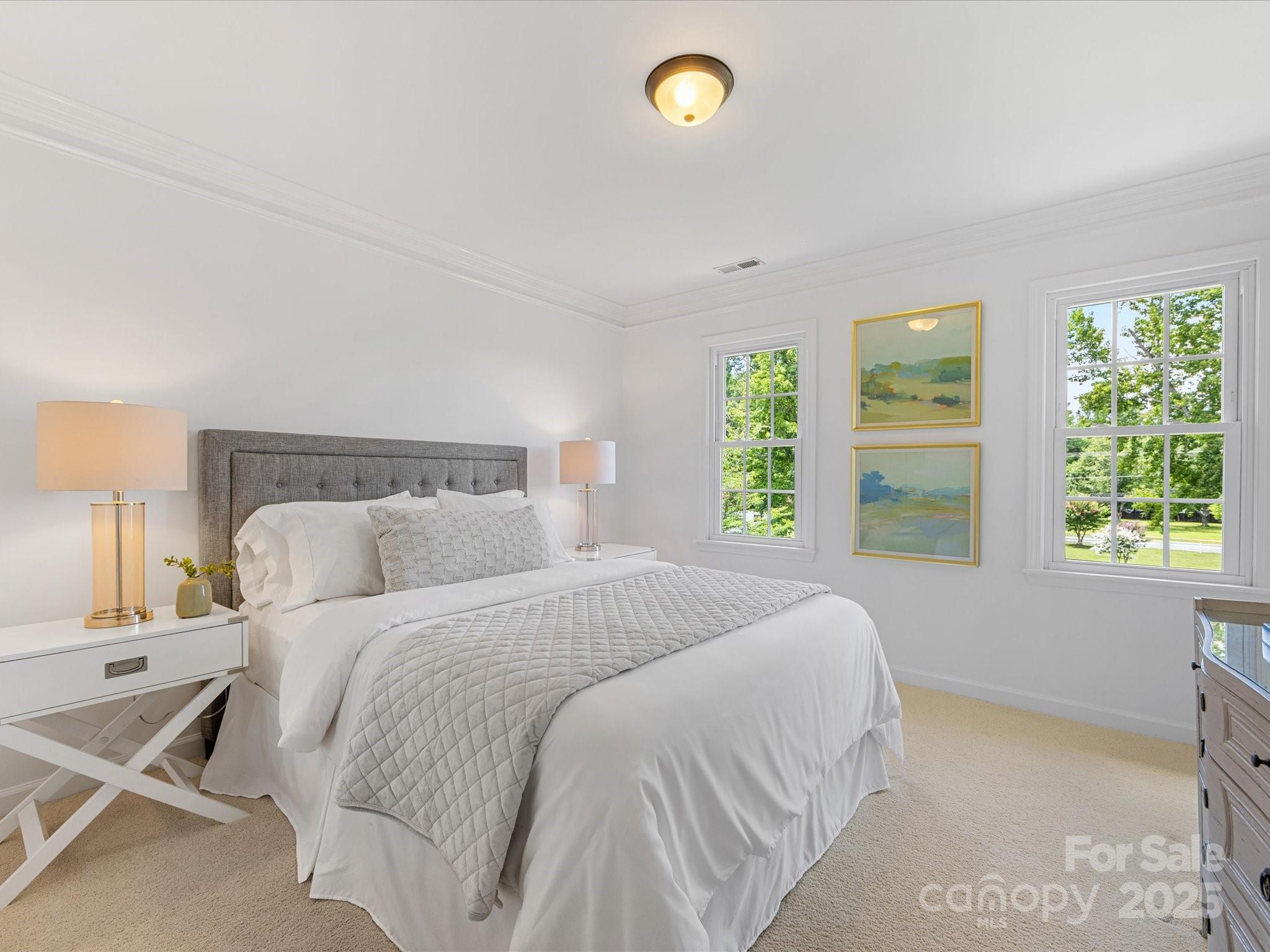 11215 Idlewild Road Matthews, NC 28105 - Photo 28 of 48 a bedroom with a bed and window