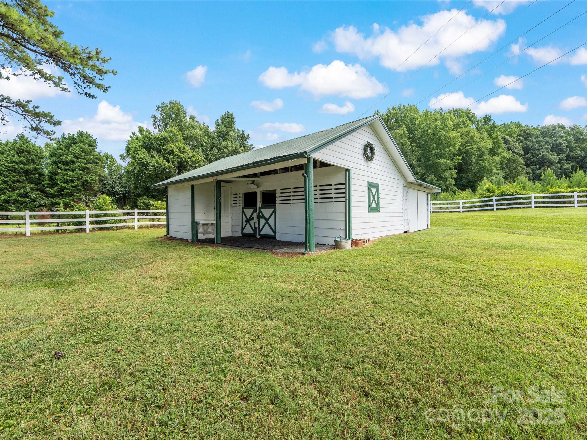 11215 Idlewild Road Matthews, NC 28105 - Photo 32 of 48 a front view of house with yard and green space